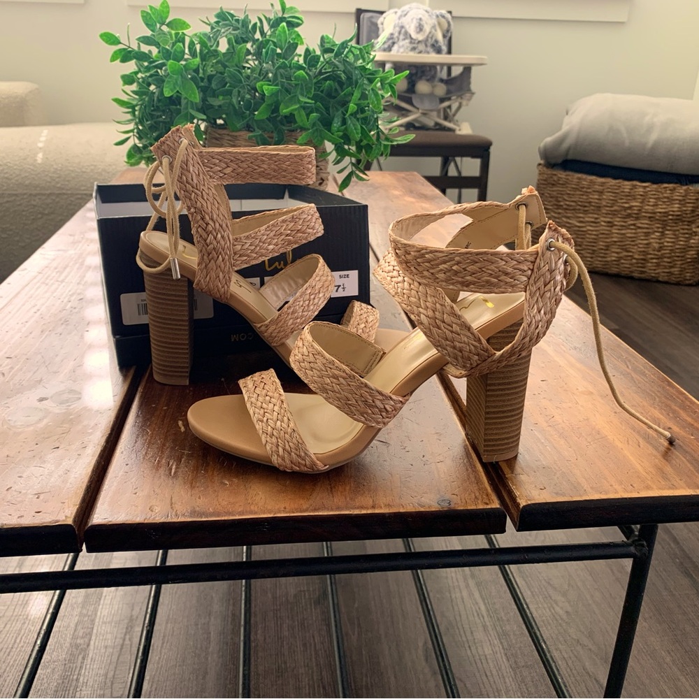 Strappy heel sandals , nice heel size never worn